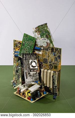 Abstract Figure Folded From Computer Circuit Boards On A Colored Background