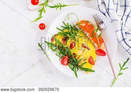Omelette With Tomatoes, Cheese, Ham And Sandwich Wich Red Cavier On Plate.  Frittata - Italian Omele