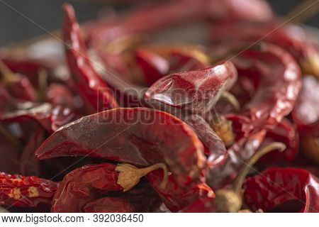 Dried Red Chili Or Chilli Cayenne Pepper On Black Marble Background, Close Up