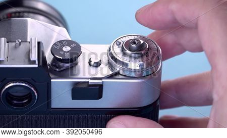 The Photographer Prepares Press The Button Shutter Release It On A Vintage 35mm Film Analog Camera. 