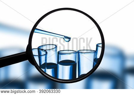 Virus Vaccine Research Laboratory Background. Blue Fluid Pipette Drop Into Glass Flask Isolated. Tes