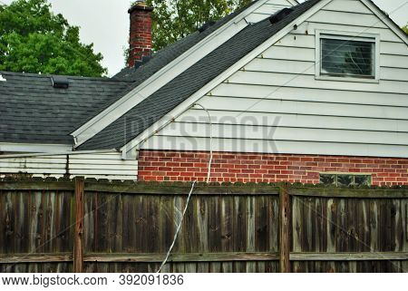 Dangerous Live Downed Power Line Draped Across Fence
