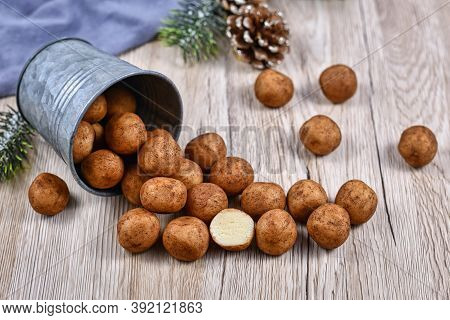 German Traditional Christmas Sweets Called 'marzipankartoffeln'. Round Ball Shaped Almond Paste Piec