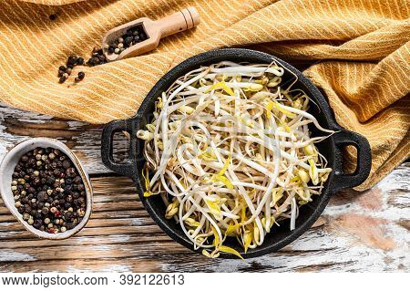 Raw White Organic Bean Sprouts In A Bowl. White Background. Top View