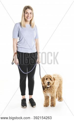 Woman With His Golden Labradoodle Dog Isolated On White Background