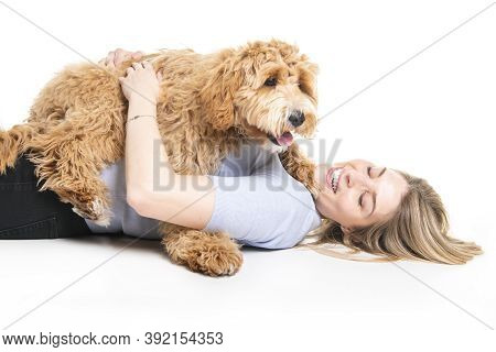 Woman With His Golden Labradoodle Dog Isolated On White Background