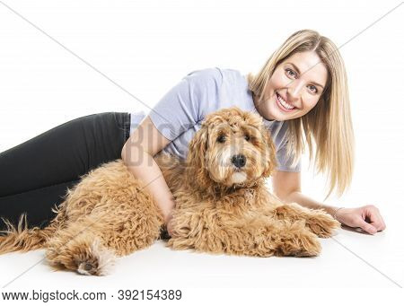 Woman With His Golden Labradoodle Dog Isolated On White Background