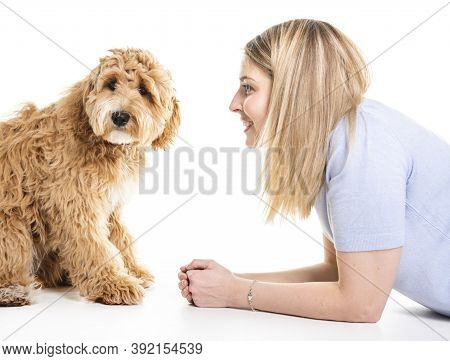 Woman With His Golden Labradoodle Dog Isolated On White Background