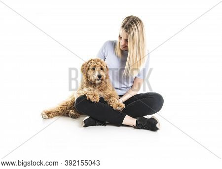 Woman With His Golden Labradoodle Dog Isolated On White Background