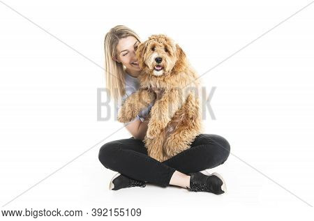 Woman With His Golden Labradoodle Dog Isolated On White Background