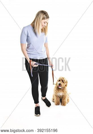 Woman With His Golden Labradoodle Dog Isolated On White Background