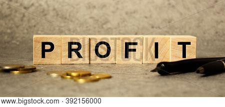 The Inscription Profit On The Texture Of Wooden Cubes On The Background Of Manet. An Inscription On 