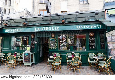 The Traditional French Restaurant La Virgule , Montmartre District Of Paris, France.
