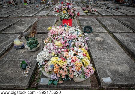 Lyon, Rhone Alpes Auvergne, October 29 2020 : Ornate Cemetery With Multicolor Flowers At Toussaint D
