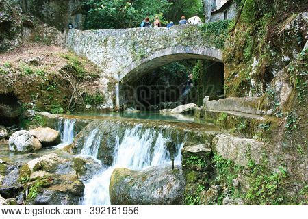 Rocky Bridge Of Candalla Over The River Waters In The Tuscan Mountains In Italy On Summer