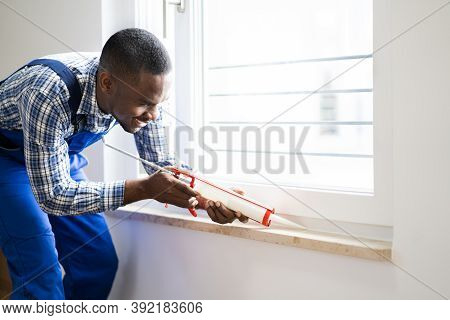 Caulk Sealant Application. Silicone Window Seal And Waterproofing