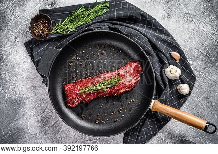 Raw Skirt, Machete Steak In A Pan With Cooking Ingredients. Gray Background. Top View