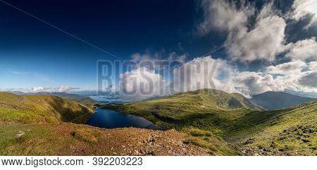 Panoramic View Of Devils Punch Bowl Lake On Mount Mangerton In The Morning. County Kerry, Killarney 