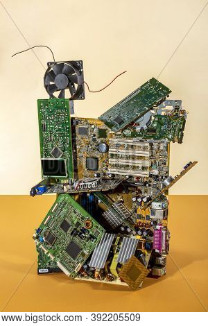 Abstract Figure Folded From Computer Circuit Boards On A Colored Background