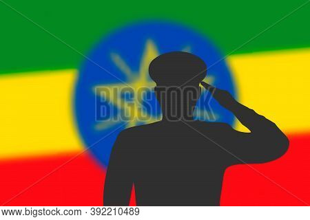 Solder Silhouette On Blur Background With Ethiopia Flag.