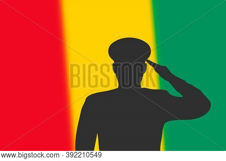 Solder Silhouette On Blur Background With Guinea Flag.