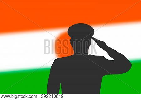 Solder Silhouette On Blur Background With Niger Flag.