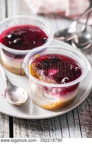 Sweet desssert. Cheesecake cup on plate.