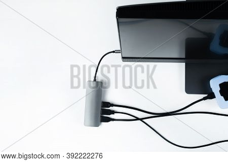 Adapter With Connection Of External Hard Drives Connected To A Monoblock On A White Background.compu