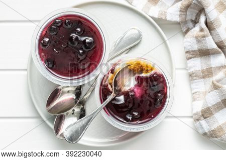 Sweet desssert. Cheesecake cup on plate. Top view.
