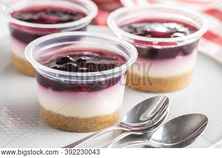 Sweet desssert. Cheesecake cup on plate.
