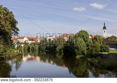 Colorful Medieval Town Pisek Above The River Otava With The Deanery Church, Czech Republic
