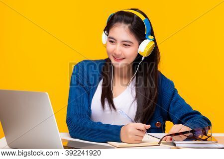 Young Student Watching Lesson Online And Wear Headphone, She Study At Home. Student Girl Listen Lect