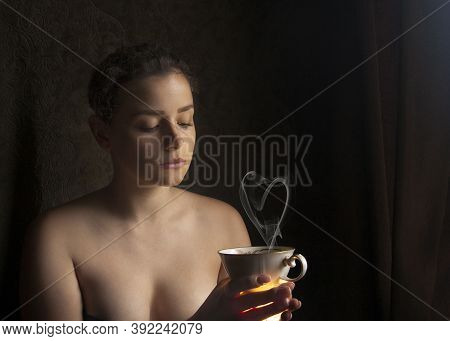 Young Woman With A Cup Of Coffee