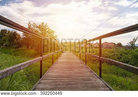 Empty Wooden Brige In Village, Sunset Sky, Nature Around.