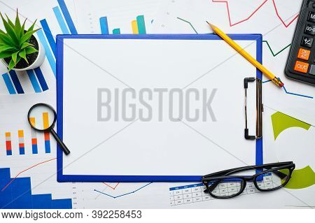 Business Endpoint With Reporting Charts On Paper And Copy Space.