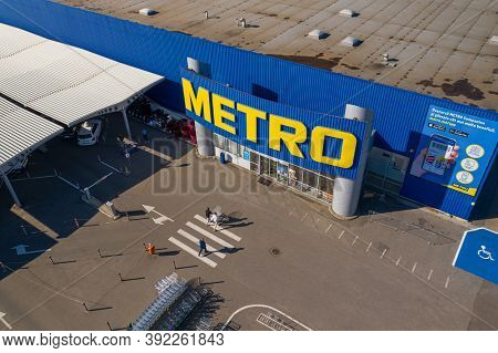 Chisinau, Moldova - October, 2020: Metro retail store, large shopping mall of household and food goods with parking, aerial view, copyspace