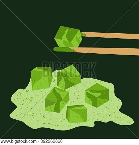 Matcha Tea Cubes. Bamboo Sticks Are Holding A Cube Of Matcha Tea.