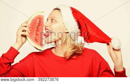 Travel Christmas Vacation And Holidays Resort. Delicious Christmas Concept. Woman Santa Hat Hold Sli