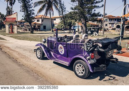 Varadero, Cuba. November 29, 2019: American Vintage Retro Car Parked On The Road On Background Of Vi