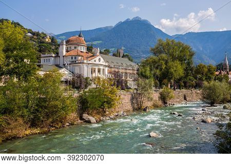 The Stream Passirio And The Kurhaus Building In Merano, South Tyrol, Bolzano Province, Italy.