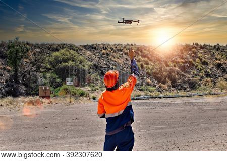 pilot catching a drone on site at a diamond mine