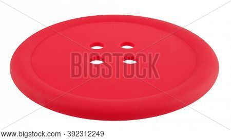 Classic round red button with four holes isolated on white background
