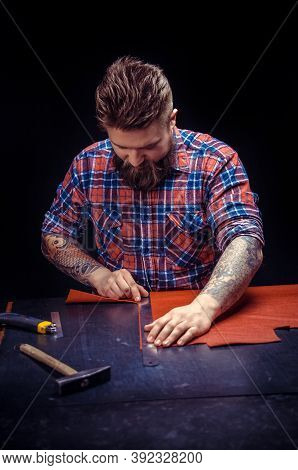 Craftsman Working With Leather Works As An Artisan At The Tanner Shop