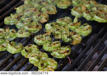 Spice Marinated Prawns Skewers On A Charcol Grill