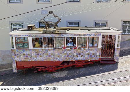 Lisbon, Portugal - June 13, 2013: Carriage Of Gloria Funicular Decorated With Azulejos Tiles In Pomb