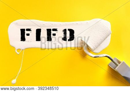 Business And Finance Concept. On A Yellow Background, The Surface Is Painted White With A Brush, On 