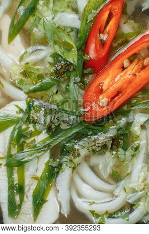 Bowl Of Chicken Noodle On Gray Concrete Background