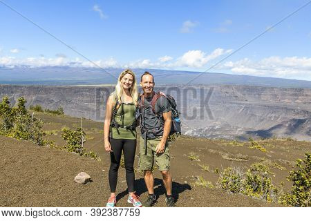 The Hiking Couple Seeing Volcano National Park From Crater On The Caldera Halemaumau Around Hawaii V