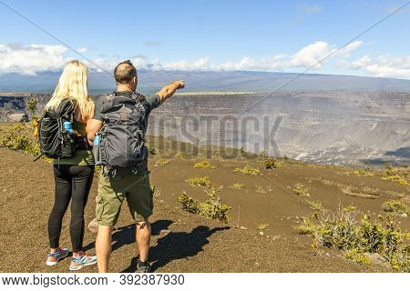 The Hiking Couple Seeing Volcano National Park From Crater On The Caldera Halemaumau Around Hawaii V