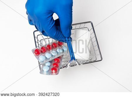 Shopping Metal Empty Basket In Male Hand In Blue Protecive Glove. Shopping During Coronavirus Lockdo